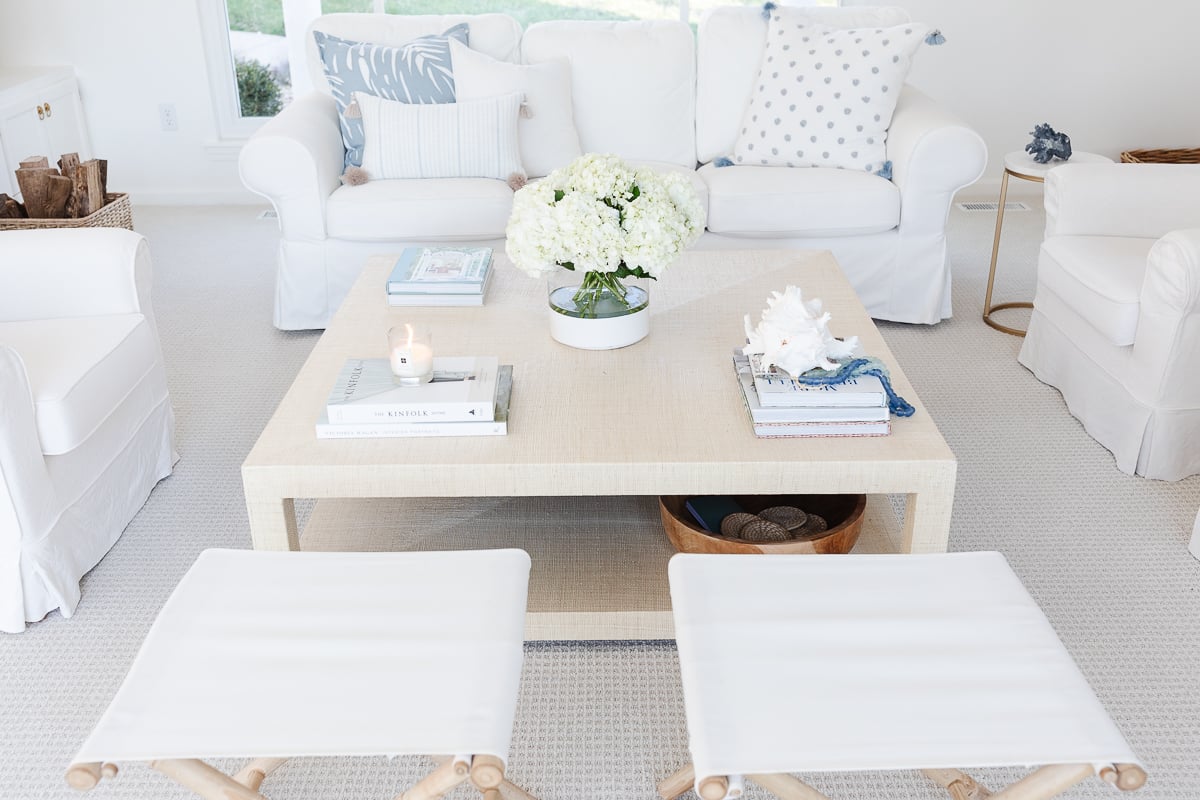 A white living room with white furniture for a vacation vibe at home.