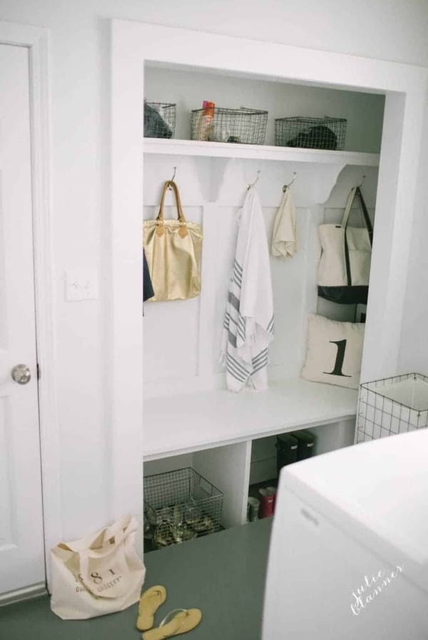 Farmhouse style mudroom with hooks and baskets, closet mudroom space.