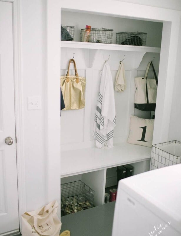 Farmhouse style mudroom with hooks and baskets, closet mudroom space.
