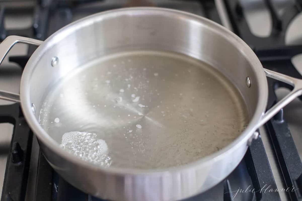 A pan on the stove with oil bubbling