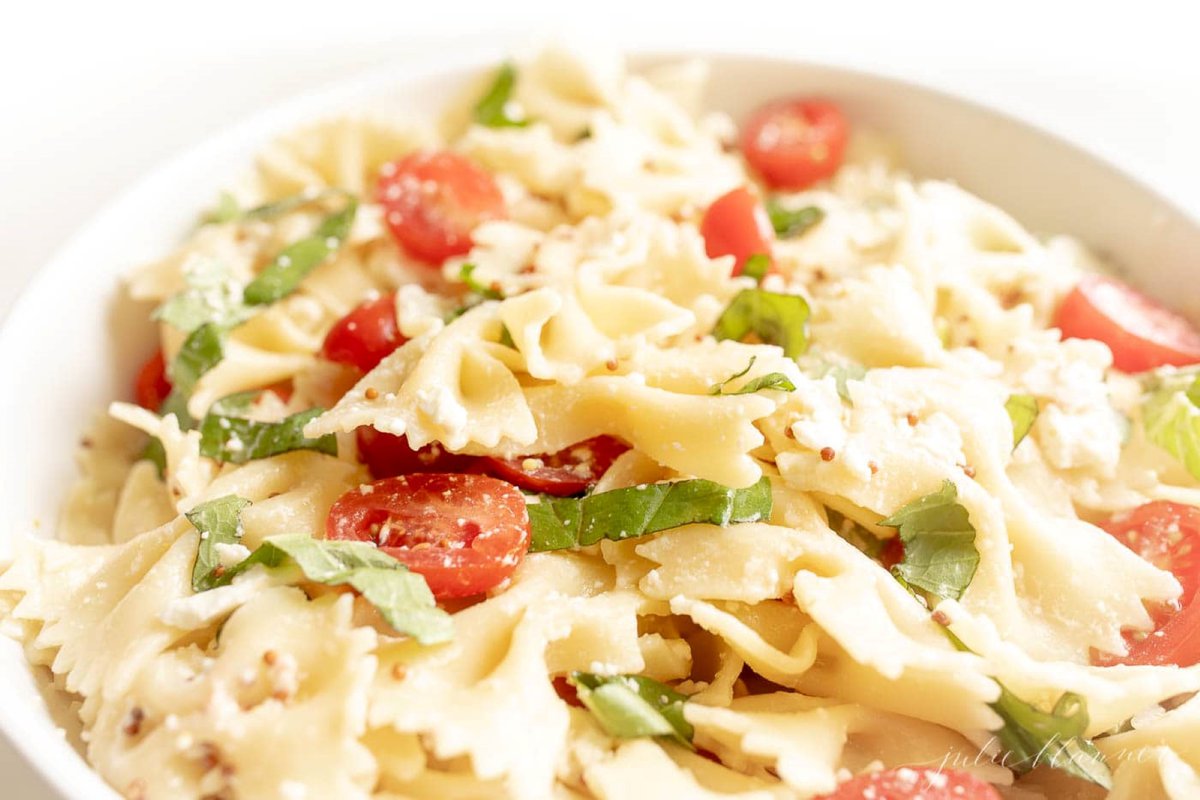 a bowl of bow tie pasta salad