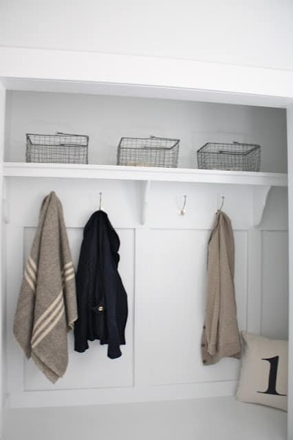 A white farmhouse inspired mudroom from a closet.