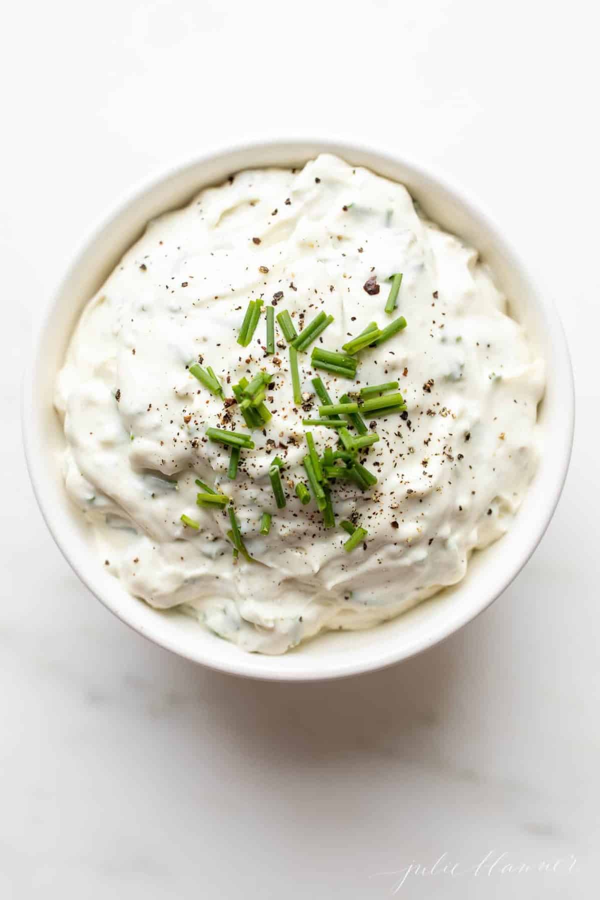 close up of blue cheese dip garnished with chives