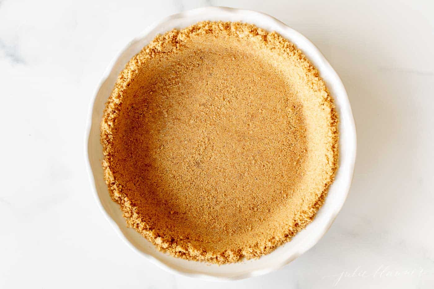 pie crust in white pie dish
