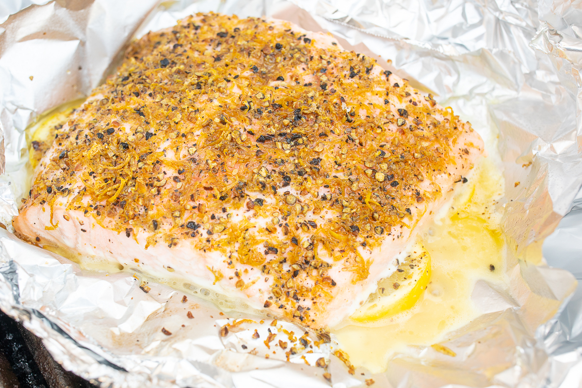 Lemon pepper salmon on a baking sheet.