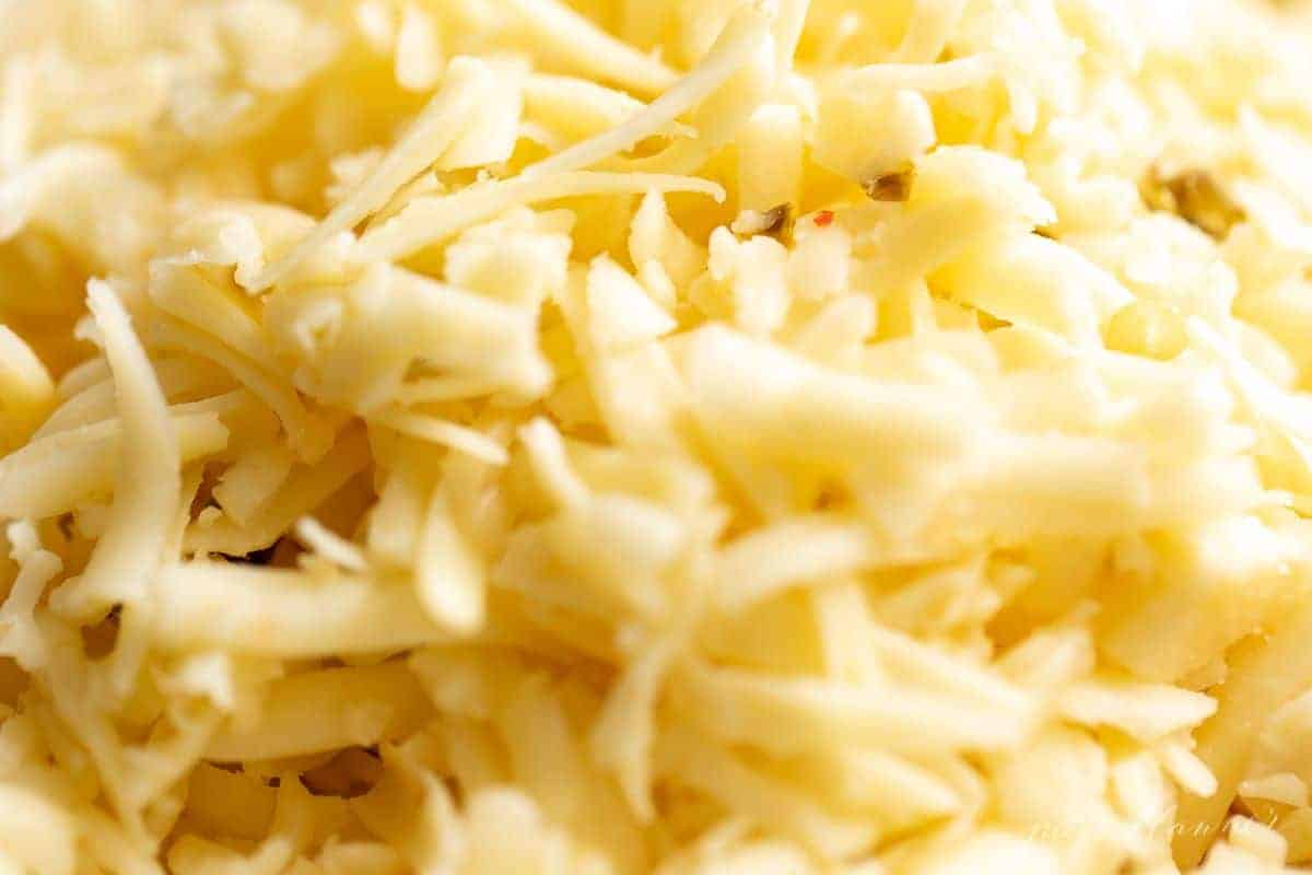 A close up of shredded Cabot brand jack cheese for cheese enchiladas.