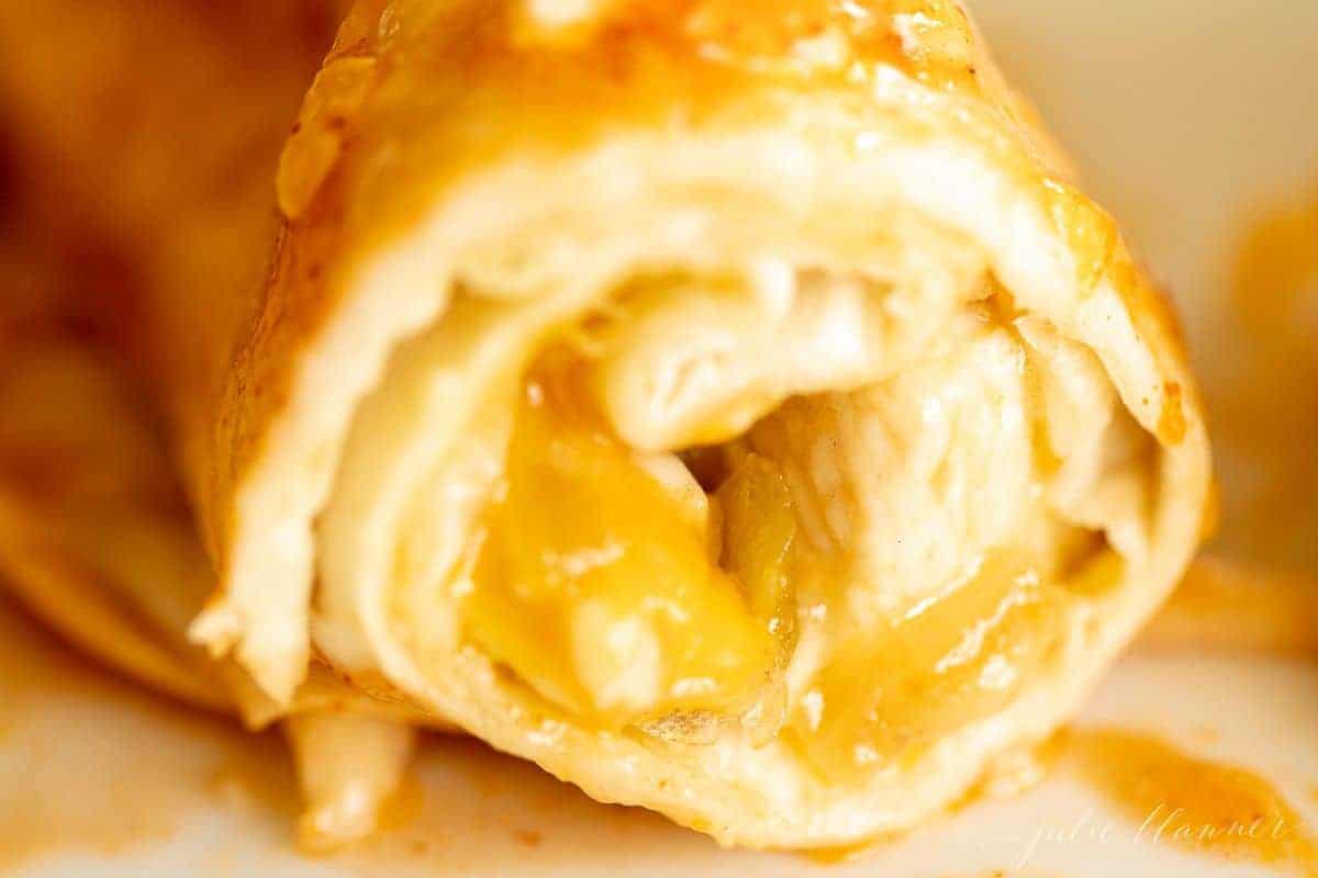 Looking into the end of a chicken enchilada.