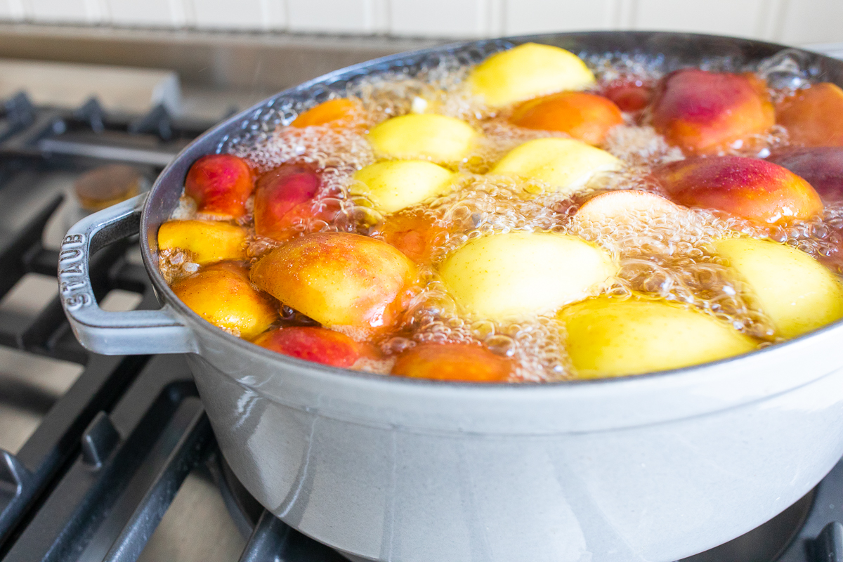 a cast iron Dutch oven filled with homemade apple cider.