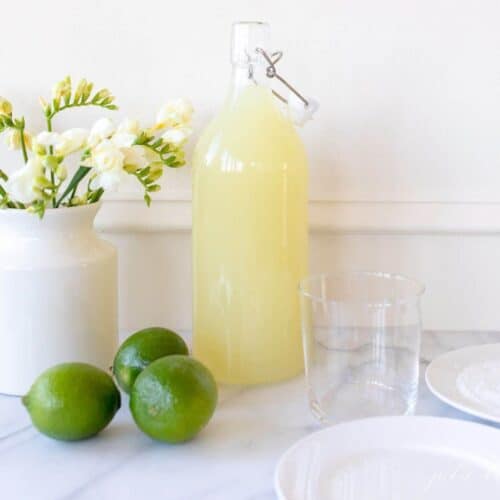daisy mix next to the limes and the rim glass
