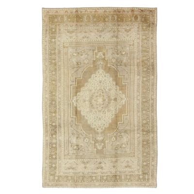 A vintage Turkish rug on a white background.