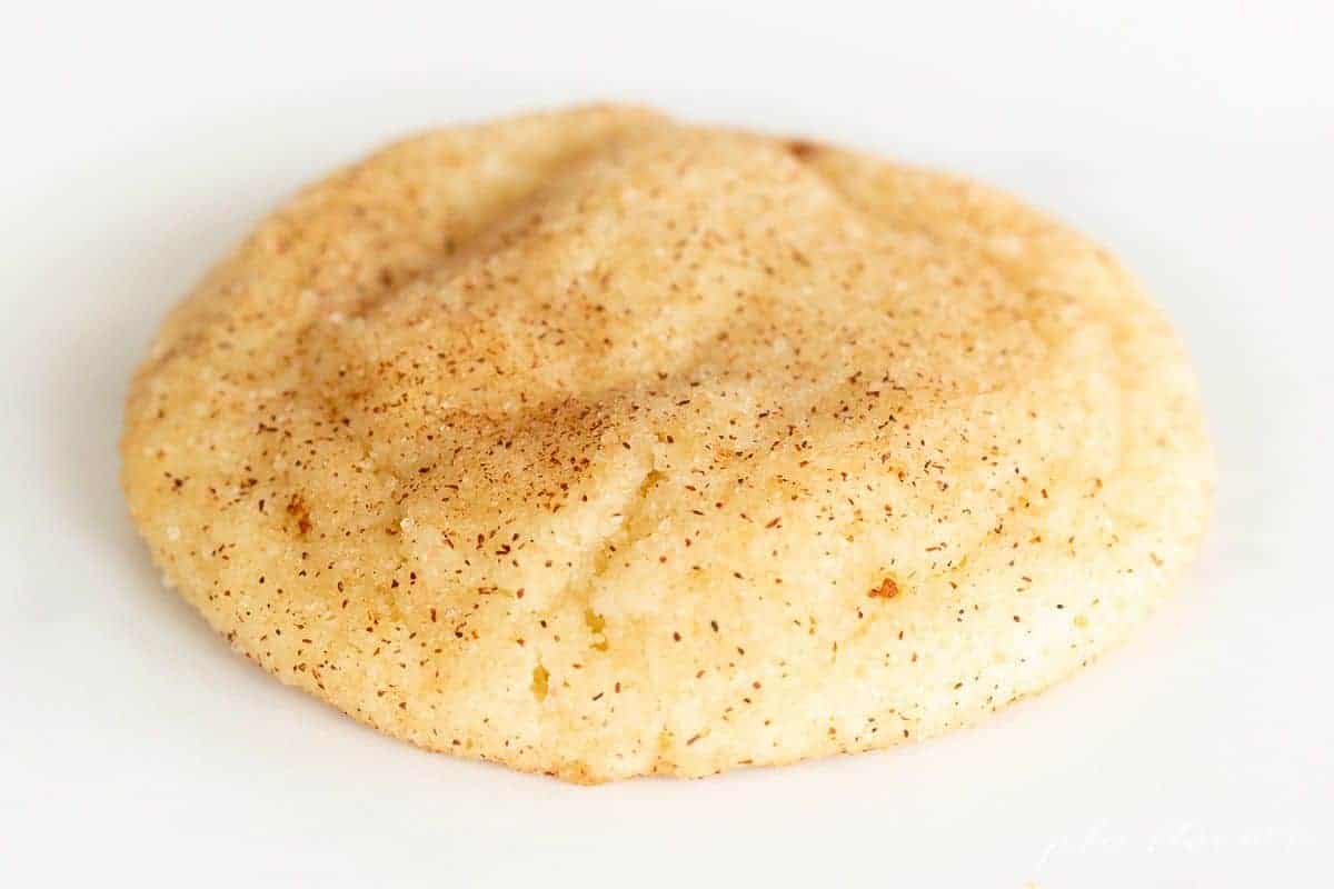 A single snickerdoodle without cream of tartar on a white background.
