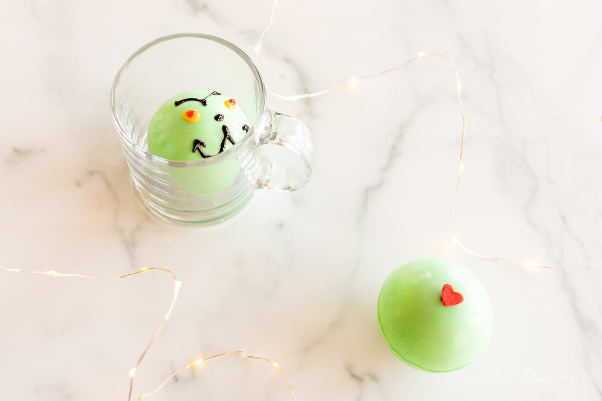Two grinch hot chocolate bombs