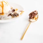 bite of phyllo covered brownie on gold spoon