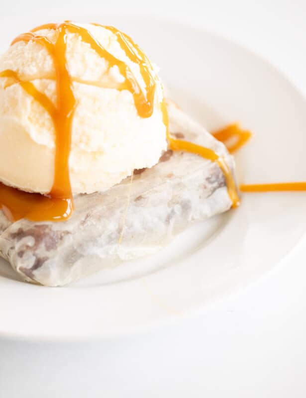 phyllo brownie on white plate topped with ice cream