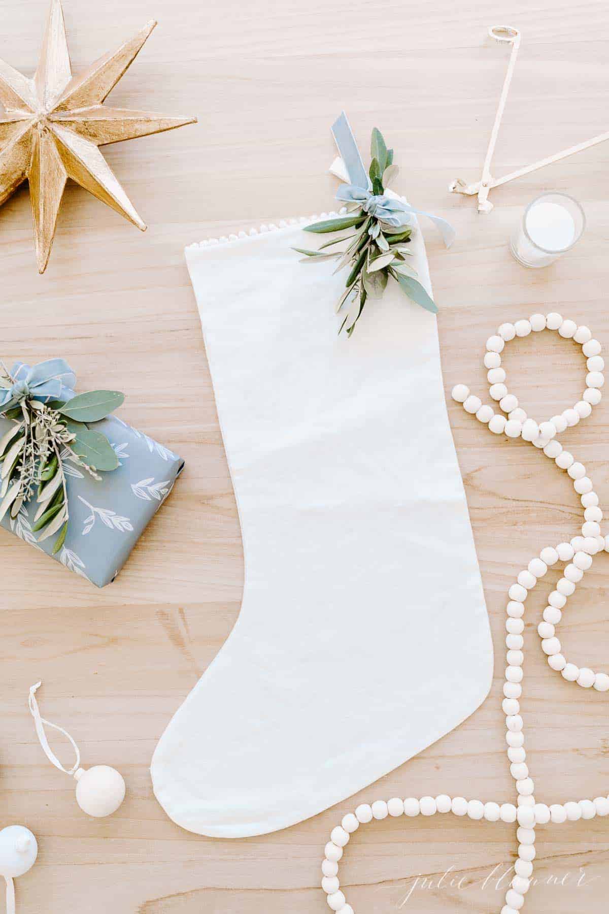 flat lay of star stocking garland gift and greenery