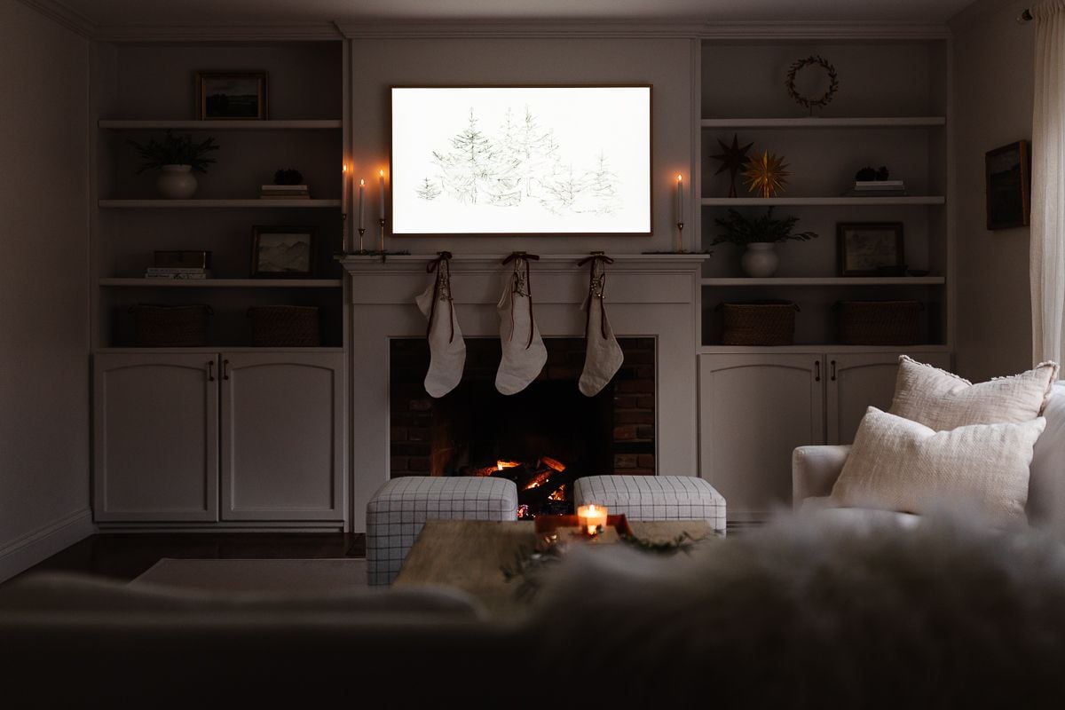 A living room with stockings on the fireplace