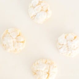 Gooey butter cookies on a white surface.