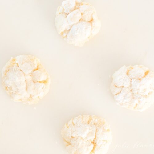 Gooey butter cookies on a white surface.