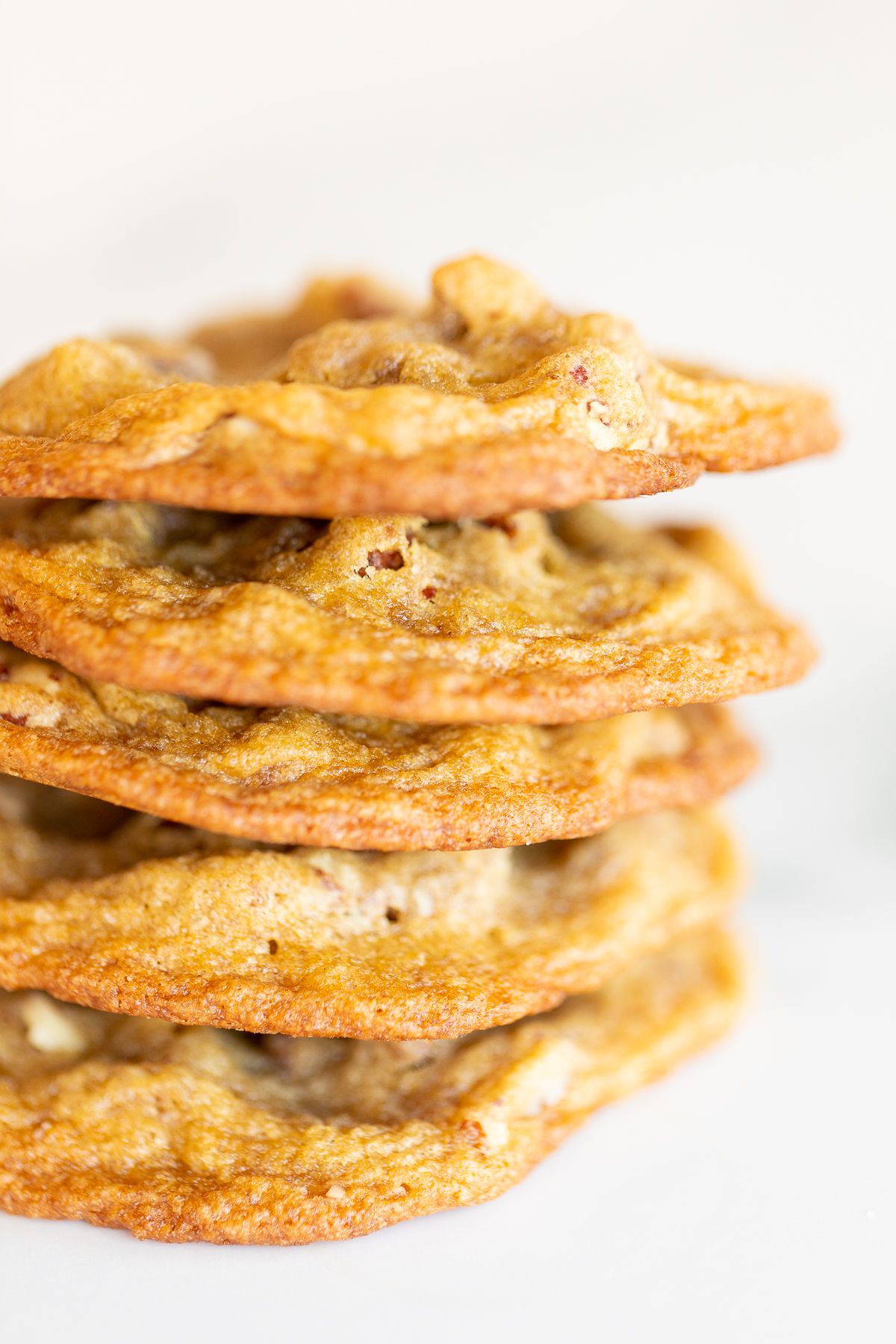 A stack of pecan pie cookies on a white countertop.