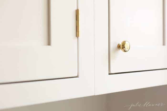 Shaker cabinet knob placement on ivory cabinets.