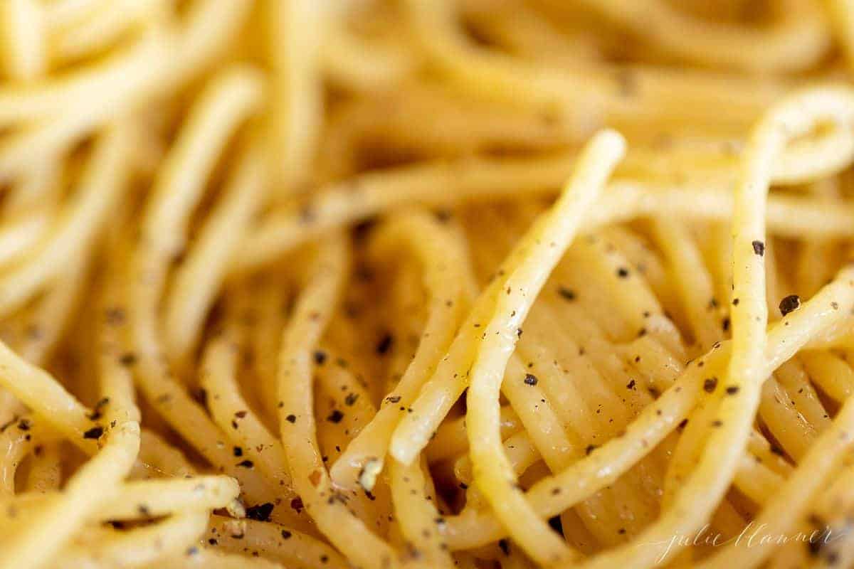 A close up of cacio e pepe spaghetti.