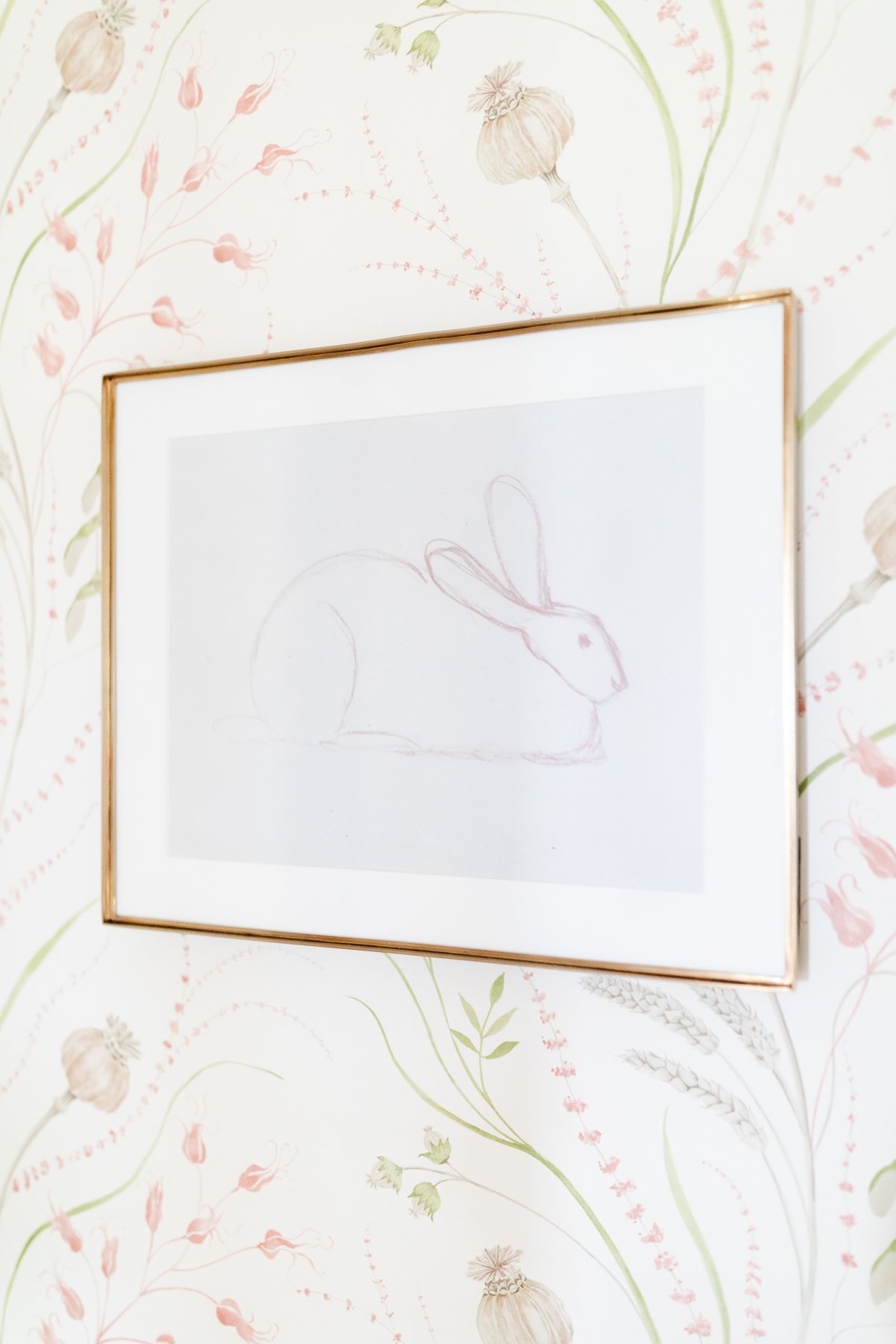 A framed drawing of a rabbit on a wall, sourced from Studio McGee's public domain art collection.