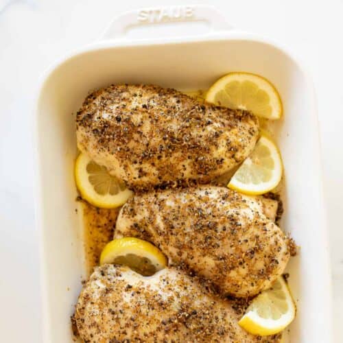 lemon pepper chicken in white casserole dish