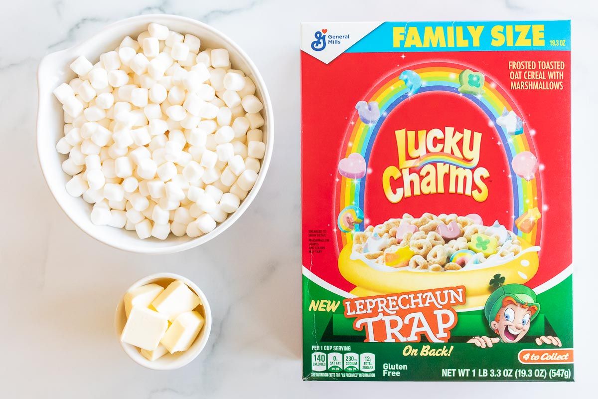 Ingredients for lucky charm bars laid out on a marble countertop.