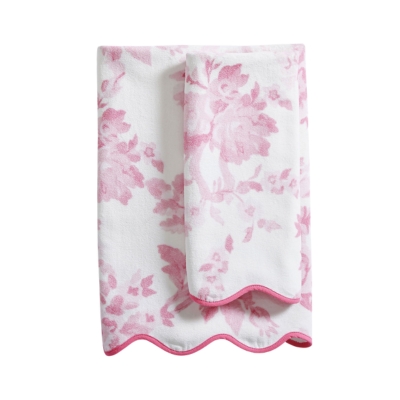 A coquette pink and white towel with a floral pattern, perfect for a tween bedroom.