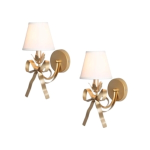 A pair of gold sconces with a white shade will add a touch of glamour to any tween bedroom.