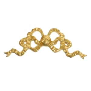 A gold plated coquette knob with a bow - perfect for tween bedroom ideas.