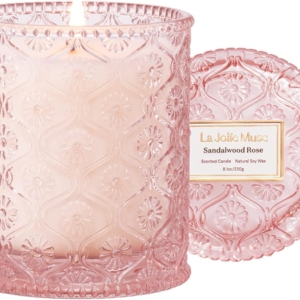 A pink glass candle with a matching lid, perfect for a tween girl bedroom.