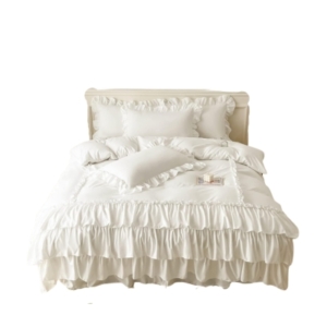 Create a chic and feminine vibe in your tween girl's bedroom with a white bed adorned with ruffles.