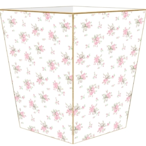 A white trash can with pink flowers on it, perfect for a tween girl bedroom.