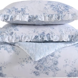 A blue and white floral comforter set with ruffles, perfect for a tween girl bedroom.