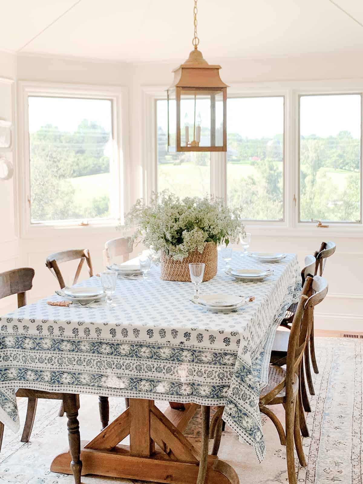 breakfast room with walls and moulding painted same cream and wood dining set