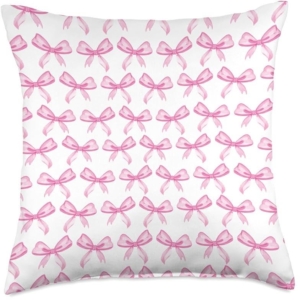 A pink pillow with bows, perfect for a tween girl bedroom.