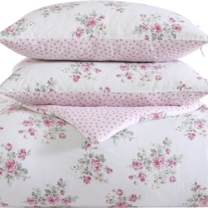 A white and pink floral bedding set with polka dots, perfect for a tween girl bedroom.