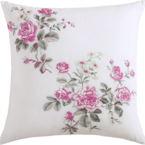 A white pillow with pink roses on it, perfect for a tween girl bedroom.