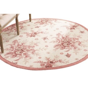 A pink and white round rug with floral design, perfect for a tween girl bedroom.