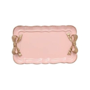 A pink and gold plate with bows, perfect for a tween girl bedroom.