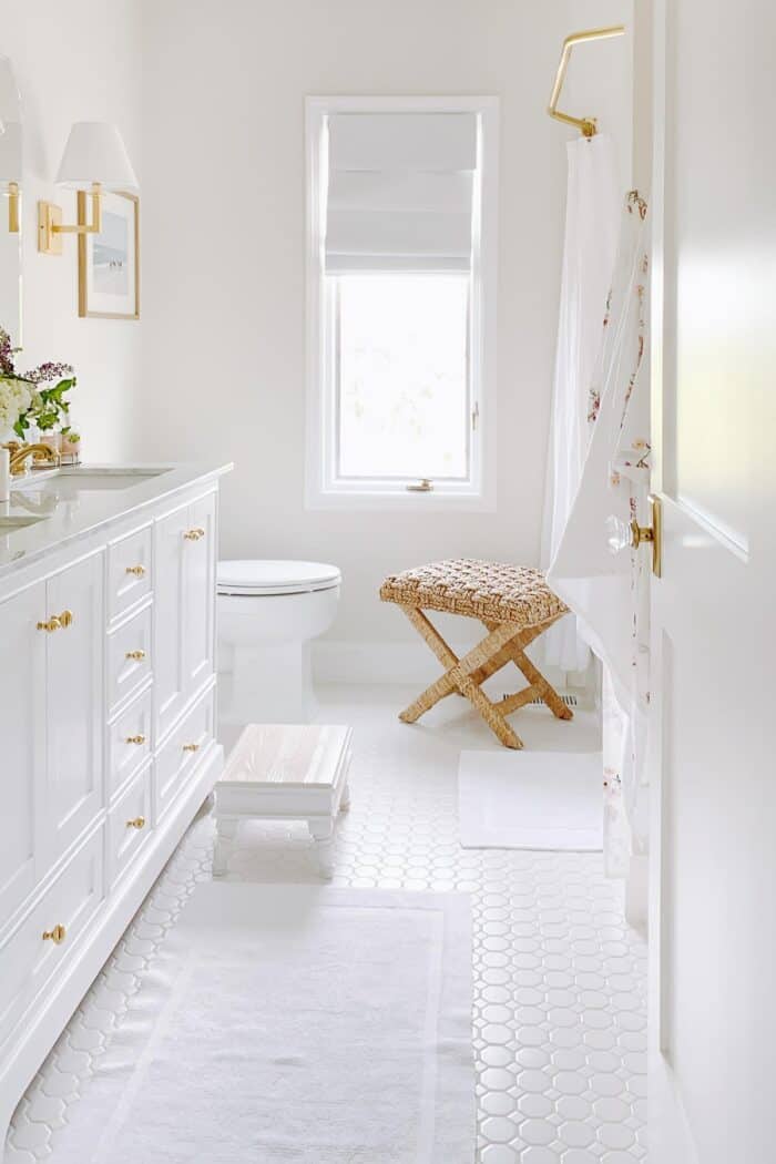 white roman shade in neutral bathroom