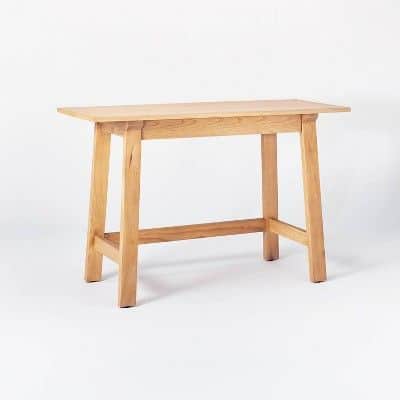 a natural wooden desk console on a white background