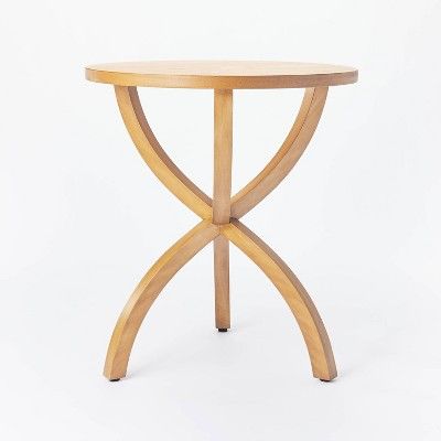 A small natural wood accent table with curved legs from studio mcgee for target