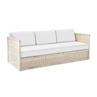 A white wicker sofa with white cushions perfect for under deck seating.