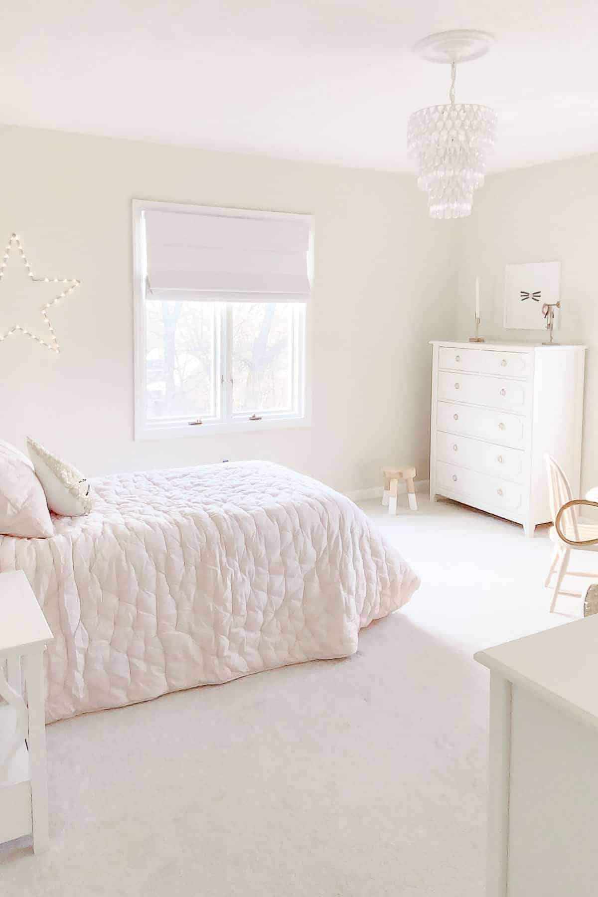 pink and cream bedroom with cordless roman shade