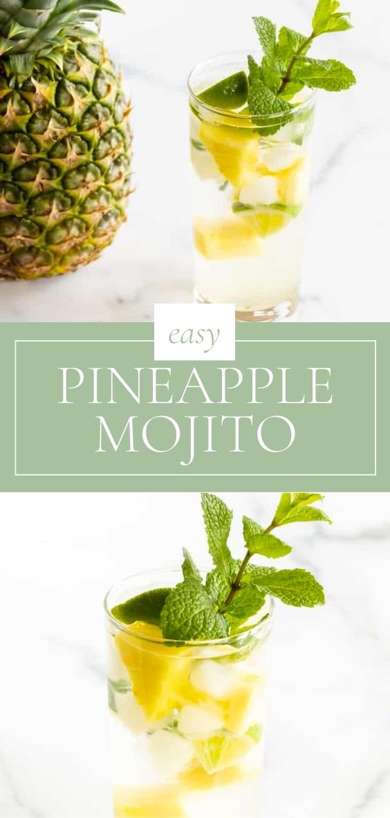 On a marble counter top, there is a pineapple mojito next to a fresh pineapple.