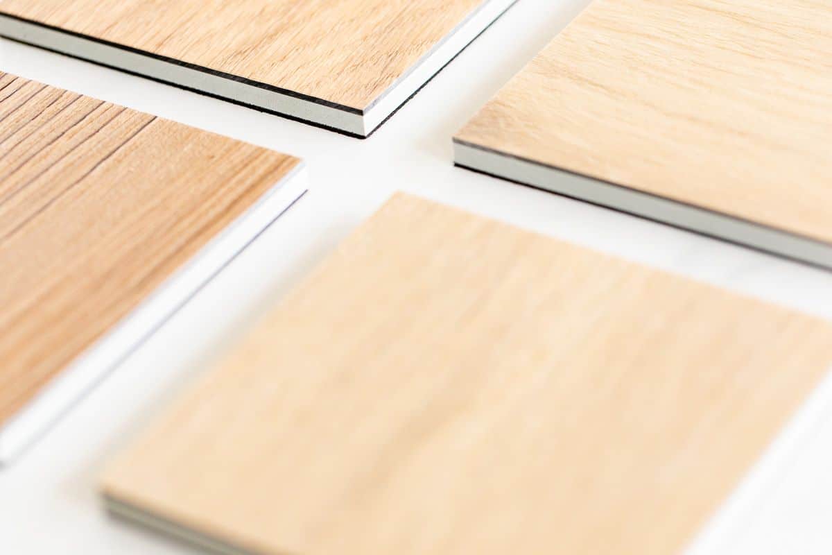 Small samples of the best vinyl plank flooring laid out on a white surface.