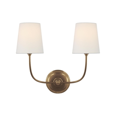 a brass wall sconce with two arms
