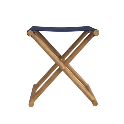 A wooden folding stool with navy canvas seat